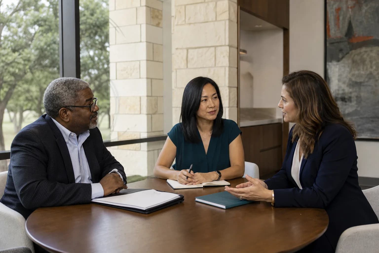 Oncology leaders interviewing a physician candidate in Austin